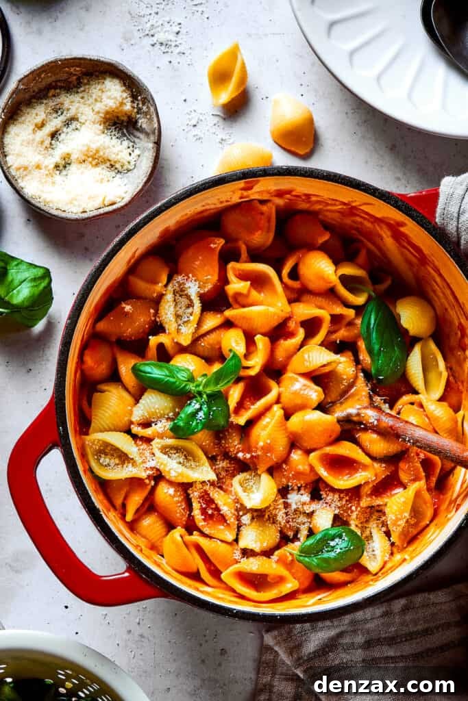 A pot of pasta shells in creamy tomato sauce.