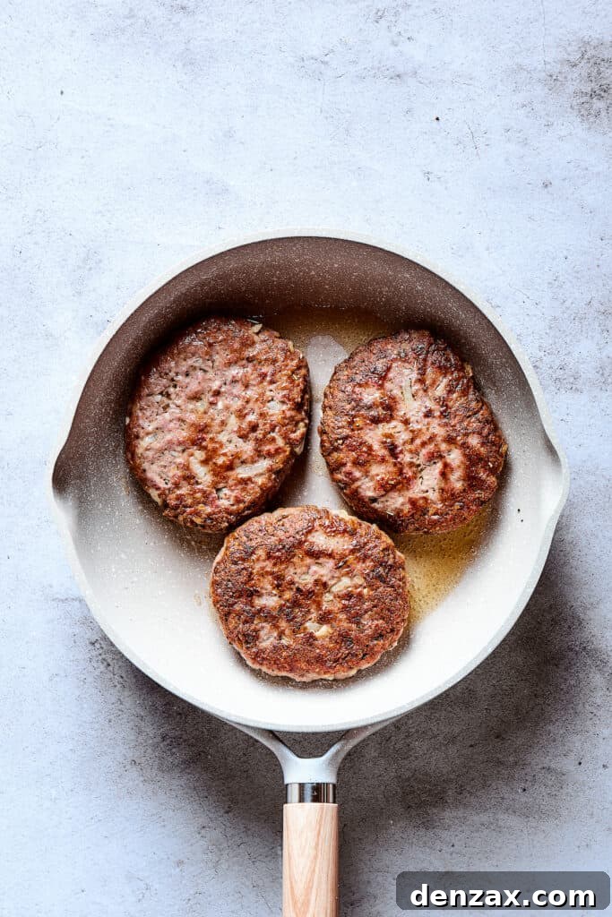 Browned patties in a skillet.