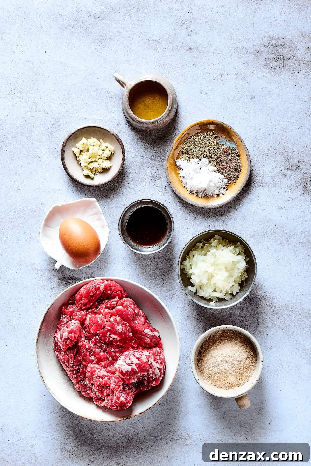 Salisbury steak ingredients measured and arranged on a work surface.