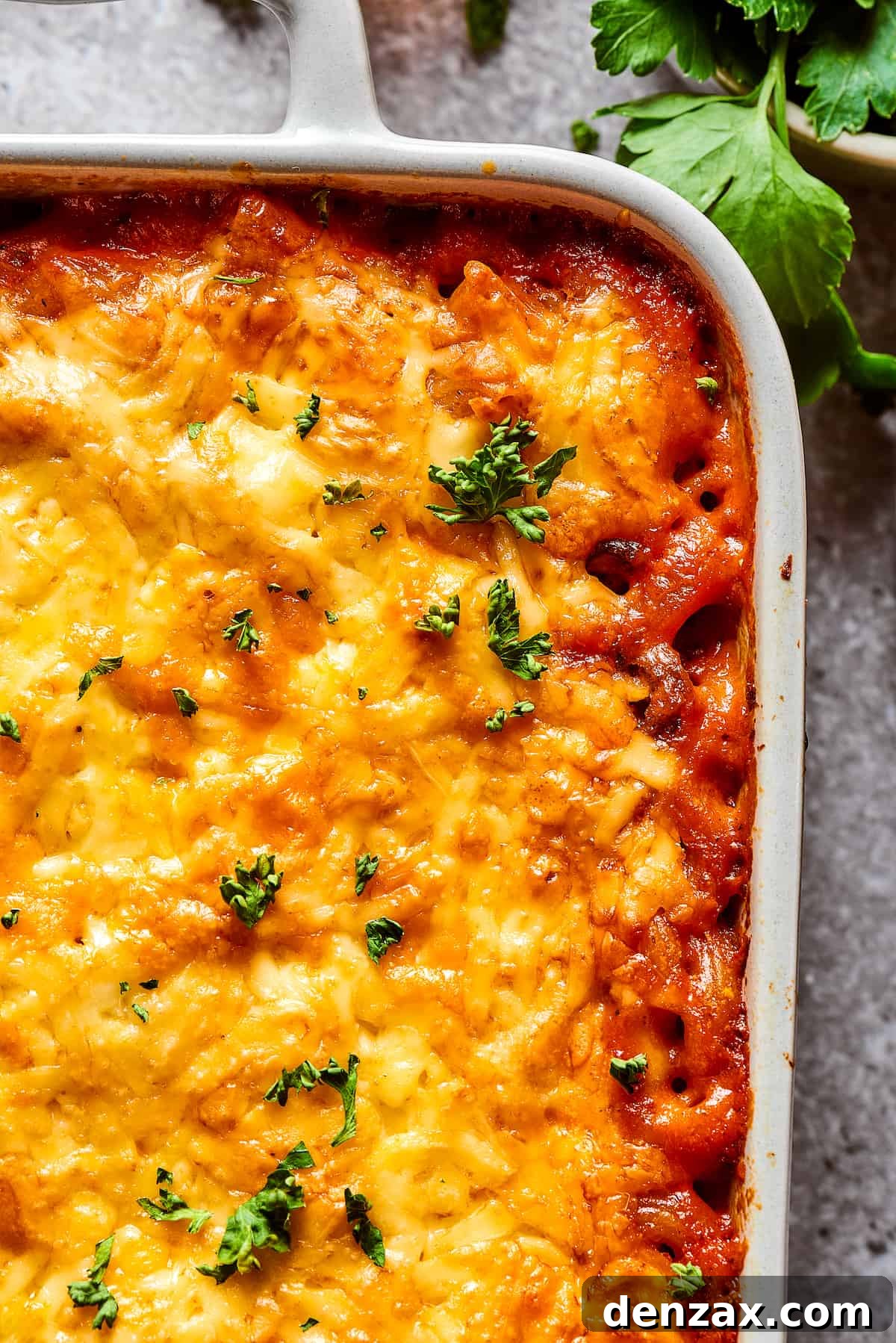 Close-up shot of the corner of a cheeseburger casserole.