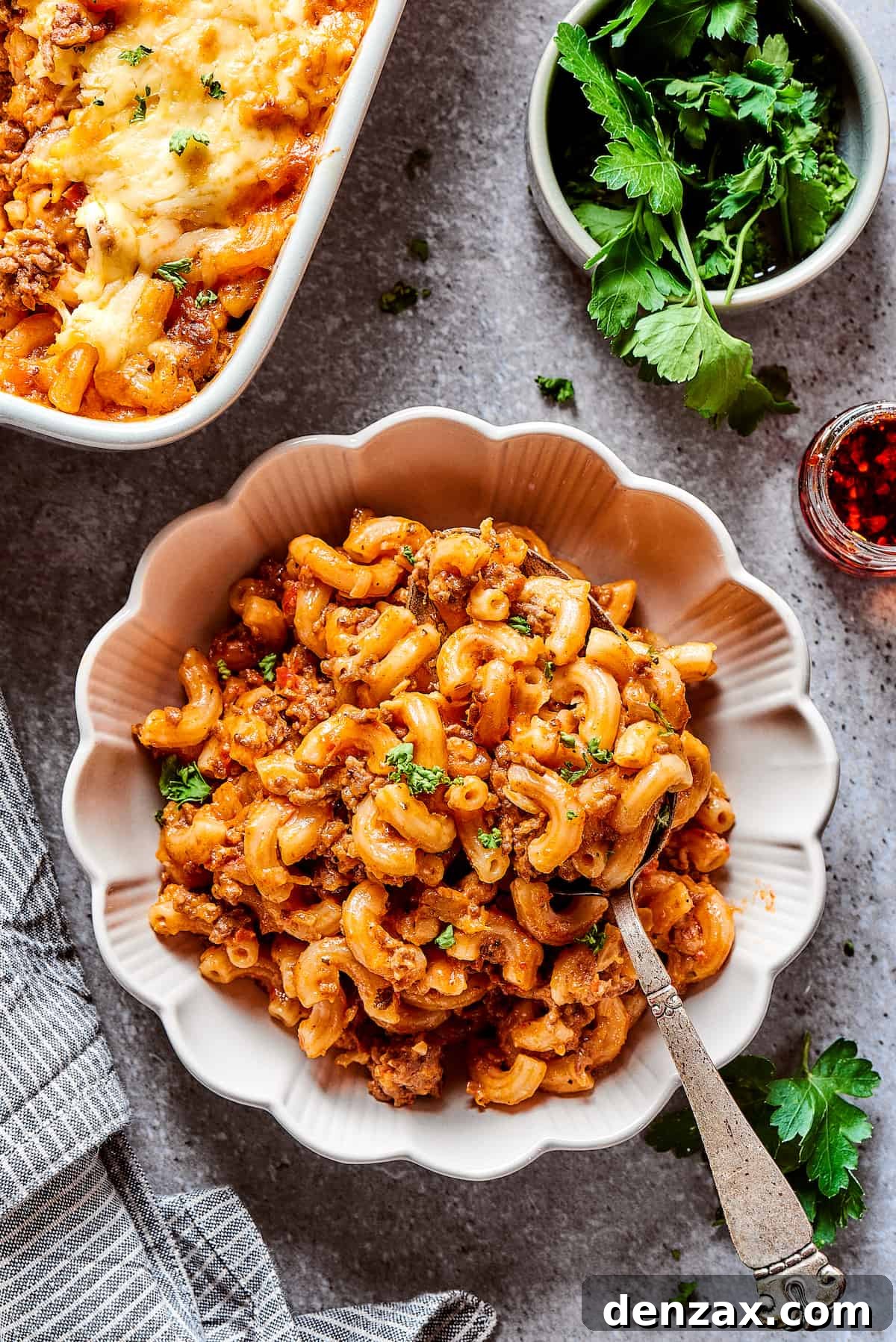 Cheeseburger casserole in a bowl with fluted edges.