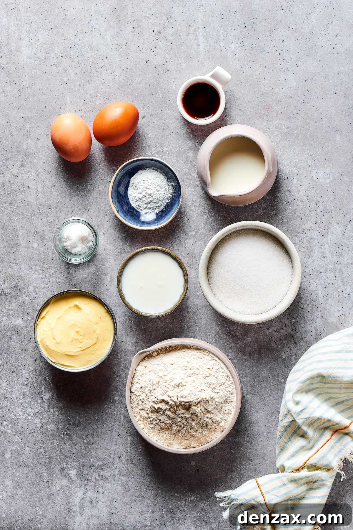 Ingredients for strawberry cupcakes measured and arranged on a work surface.