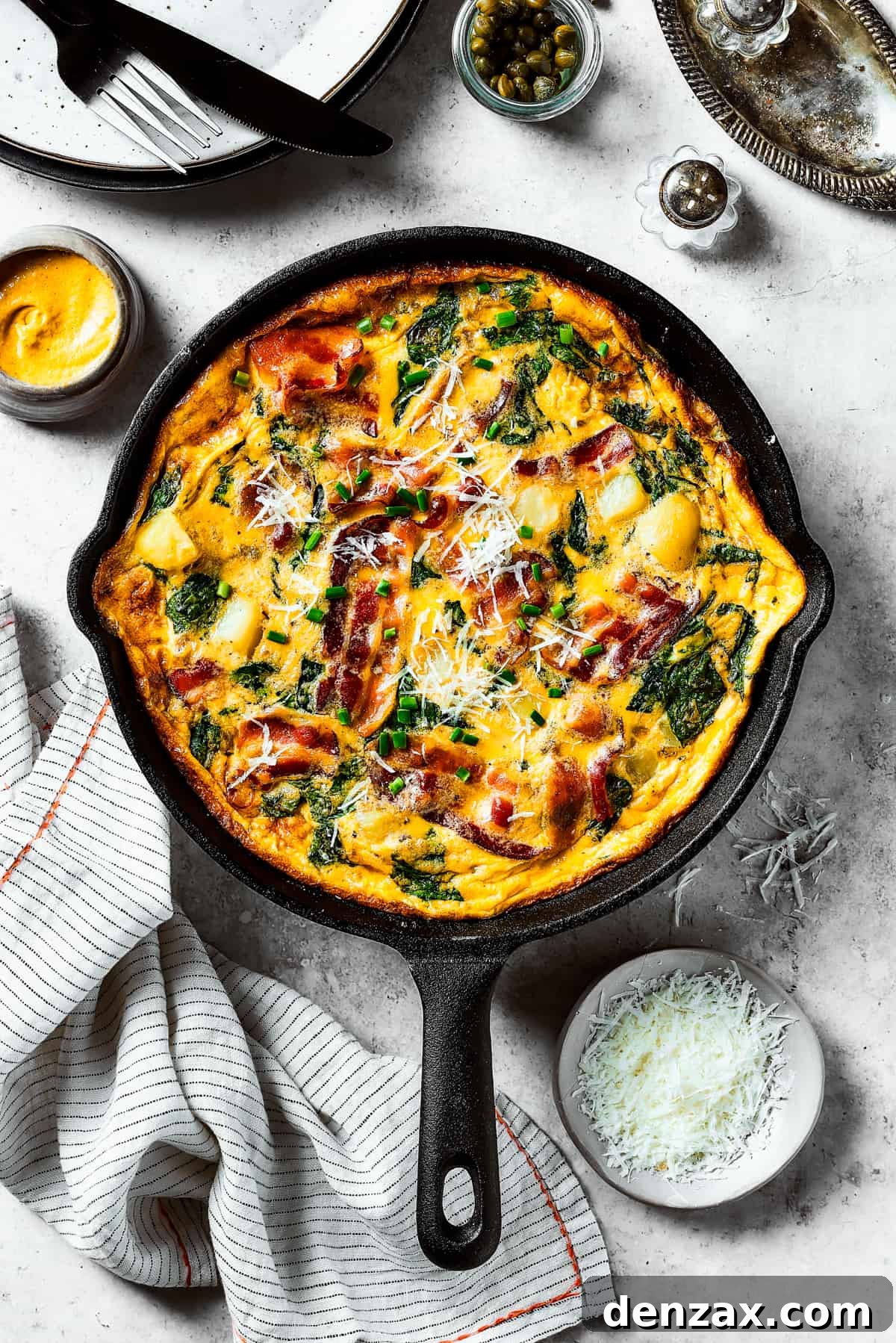 A fully-cooked frittata in a cast-iron skillet.