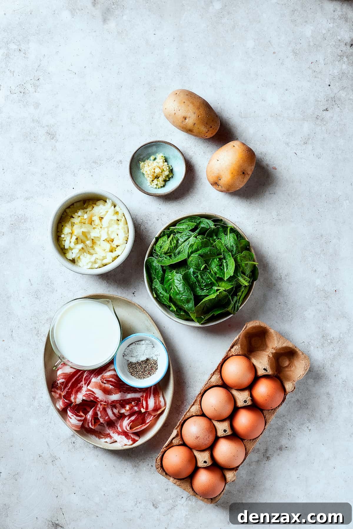 From top: Potatoes, spinach, eggs, bacon, salt and pepper, milk, onion, garlic.