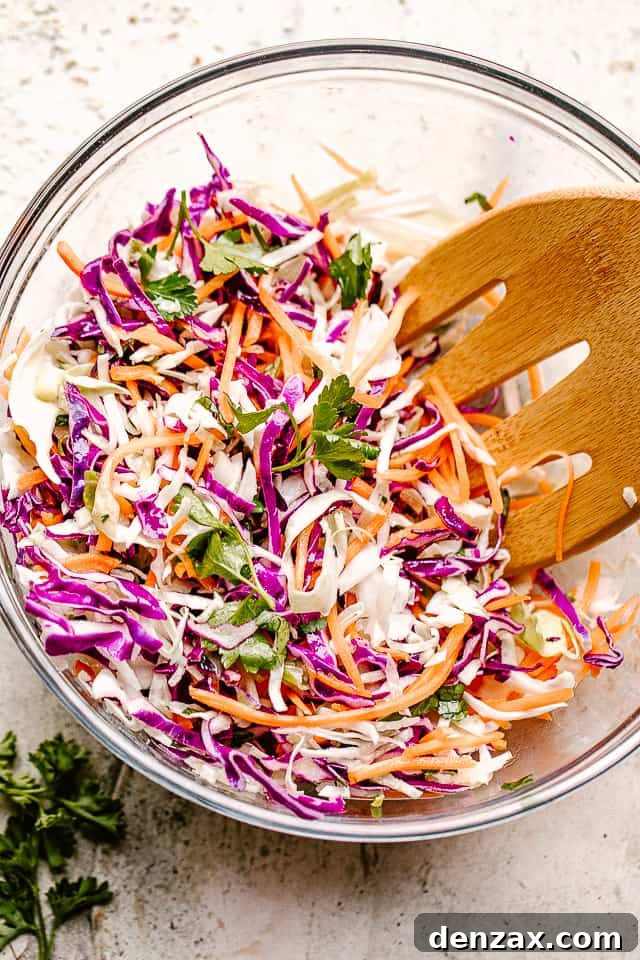 Asian cabbage slaw in a glass mixing bowl.