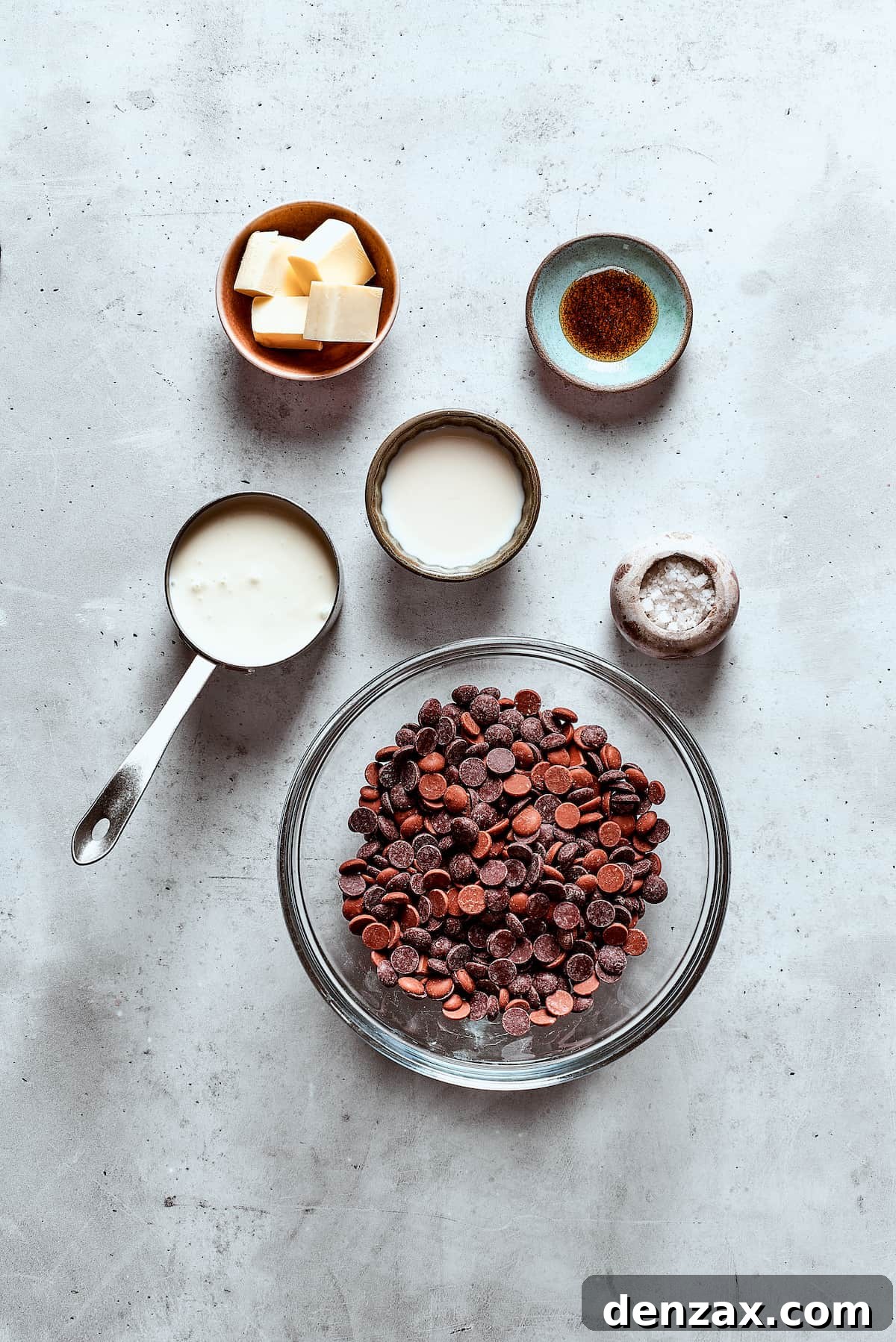 Chocolate fondue ingredients measured and arranged on a table.