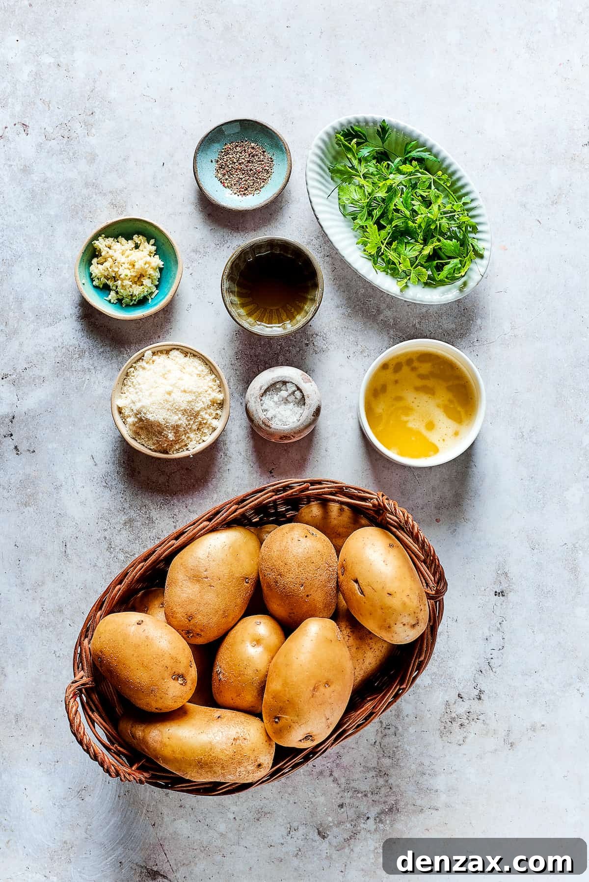 Ingredients for garlic fries, arranged in dishes on a work surface.