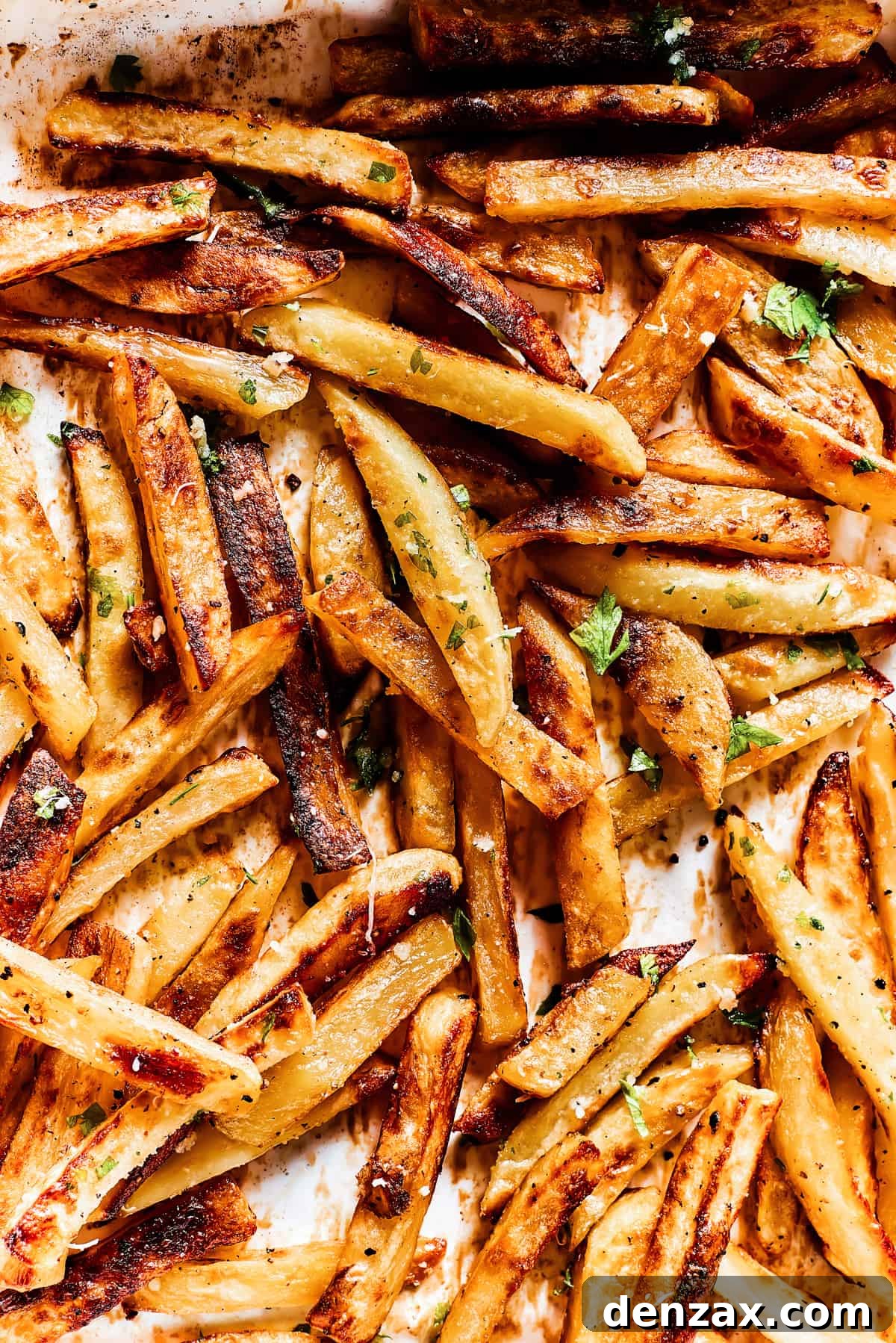 Baked fries drizzled with garlic butter and sprinkled with parsley and parmesan.