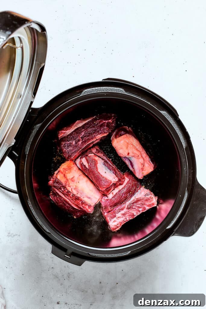 Raw short ribs in an Instant Pot.