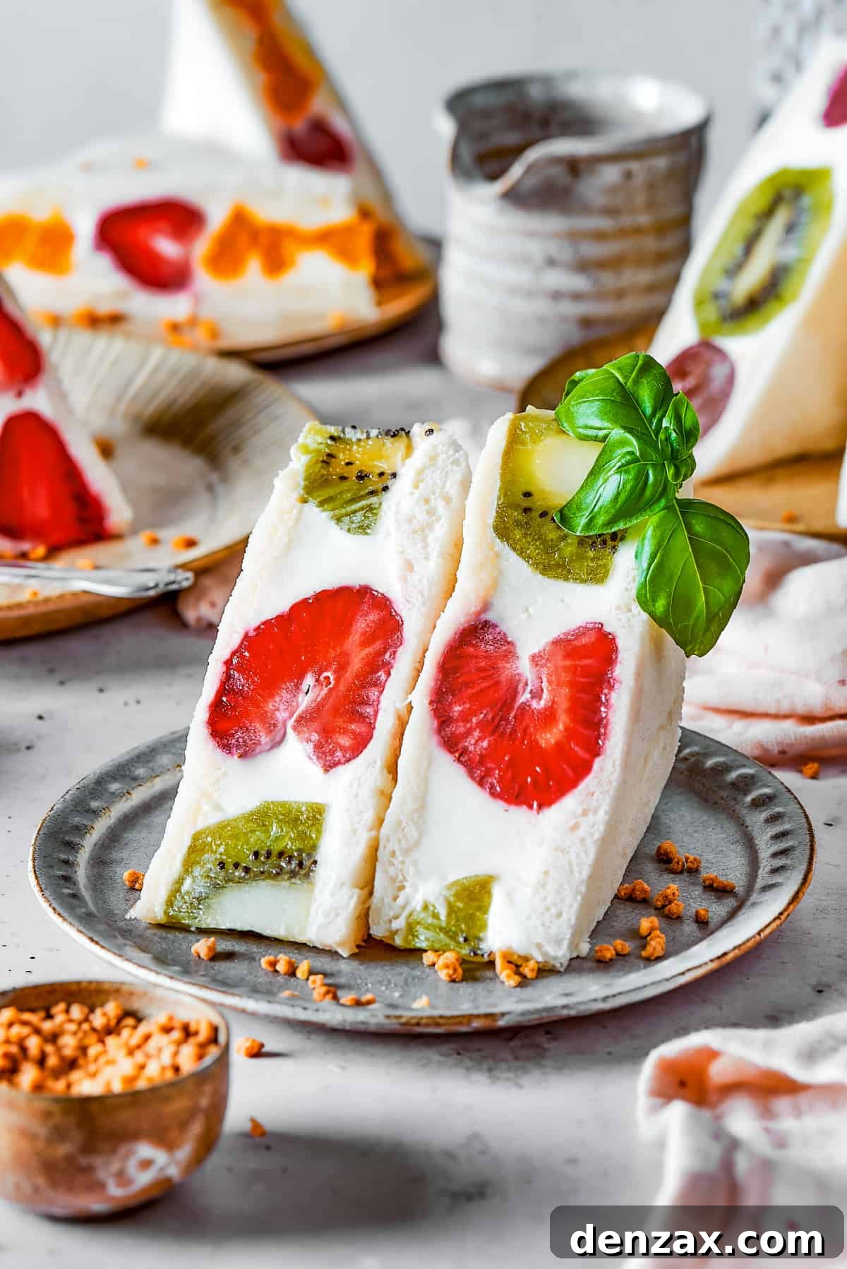 Kiwi and strawberry fruit sando on a plate.