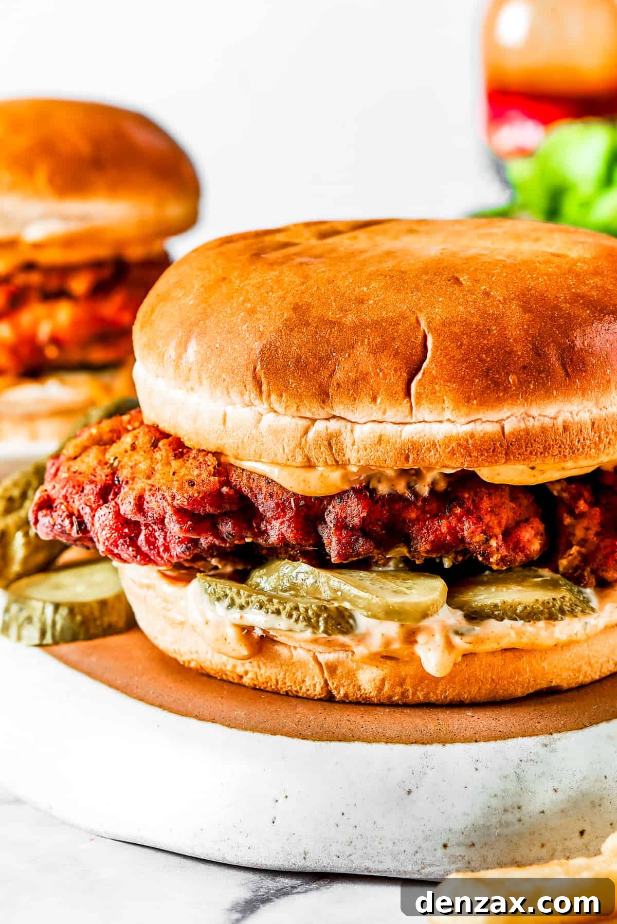 Close-up shot of a fried chicken sandwich.
