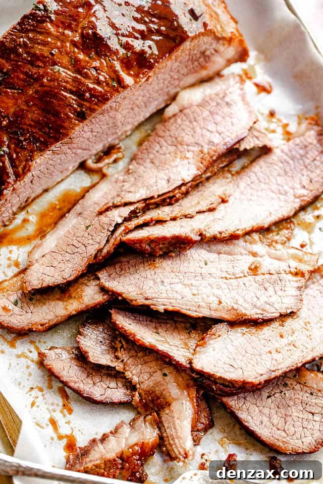 top view of sliced beef brisket set on parchment paper