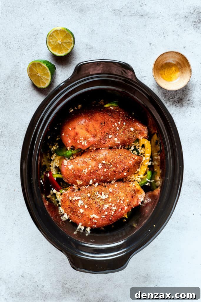 Fajita chicken in a crockpot with peppers.