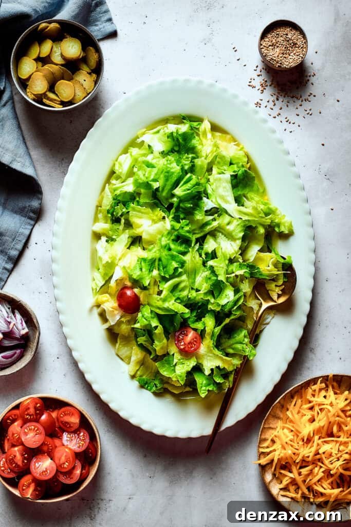 A leafy salad on an oval platter.