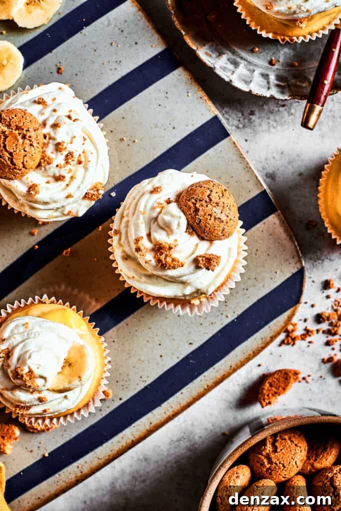 Overhead shot of frosted cupcakes on a decorative silver platter.