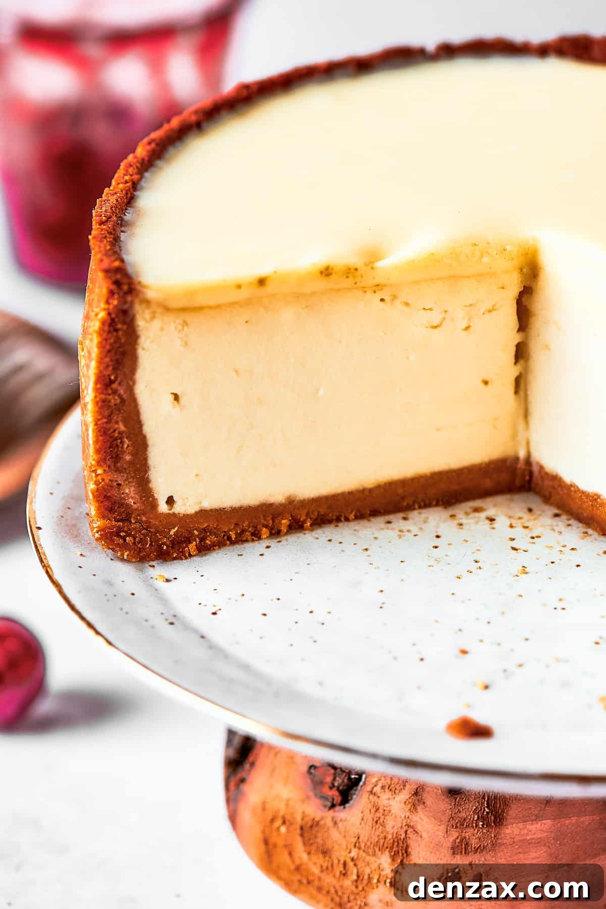 Close-up shot of the cut side of a cheesecake.
