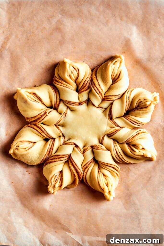 Overhead view of a fully assembled star bread before being baked.