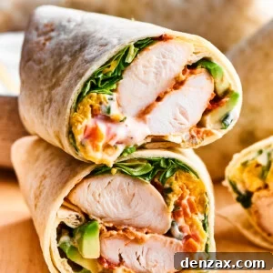 A cut buffalo chicken wrap shows the interior of chicken and vegetables.