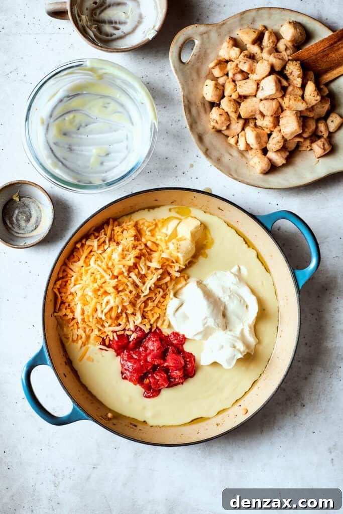 Making the creamy tomato-cheese sauce with cream of chicken soup and cream cheese.