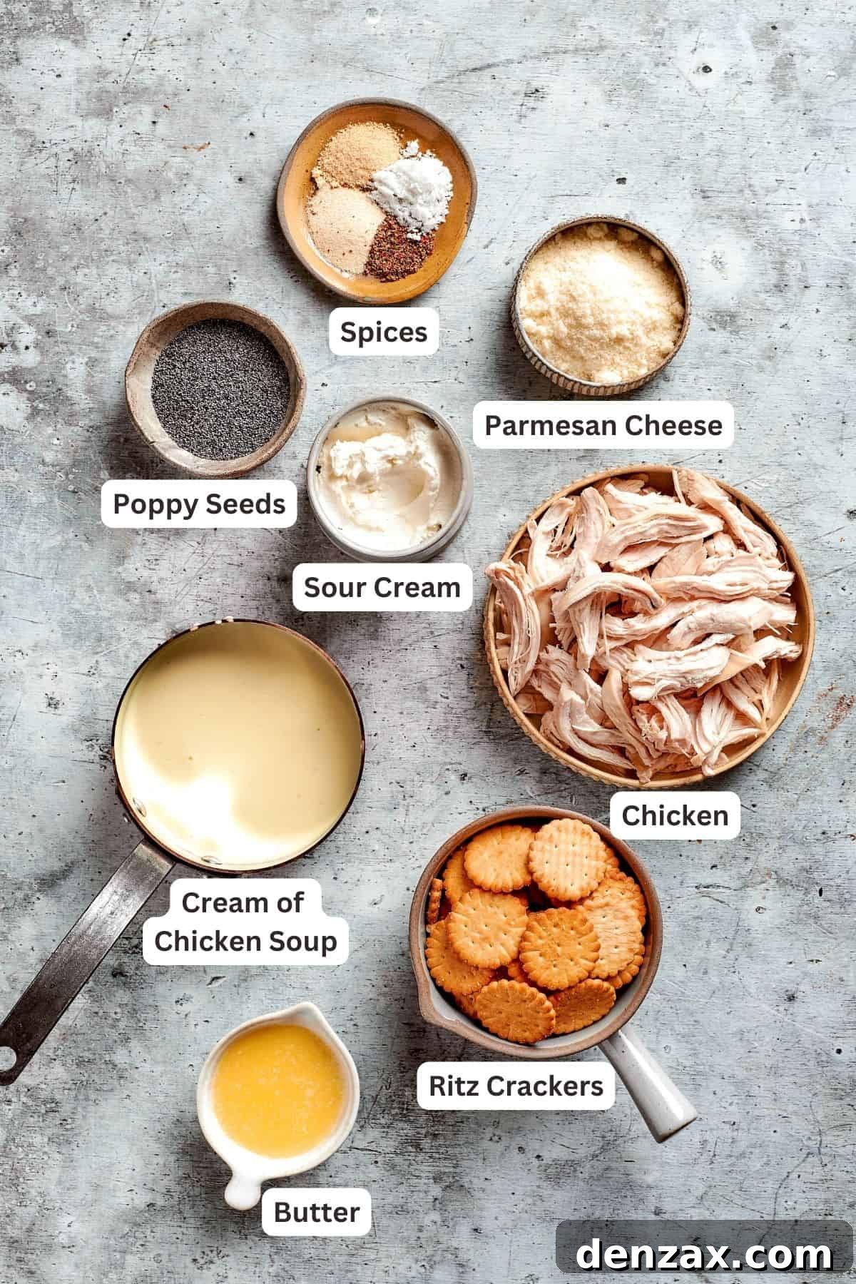 This creamy Poppy Seed Chicken casserole features a rich, poppyseed-flecked sauce that wraps cozily around tender shredded chicken. The ingredients for poppy seed chicken are shown: poppy seeds, parmesan cheese, chicken, sour cream, spices, cream of chicken soup, Ritz crackers, butter.