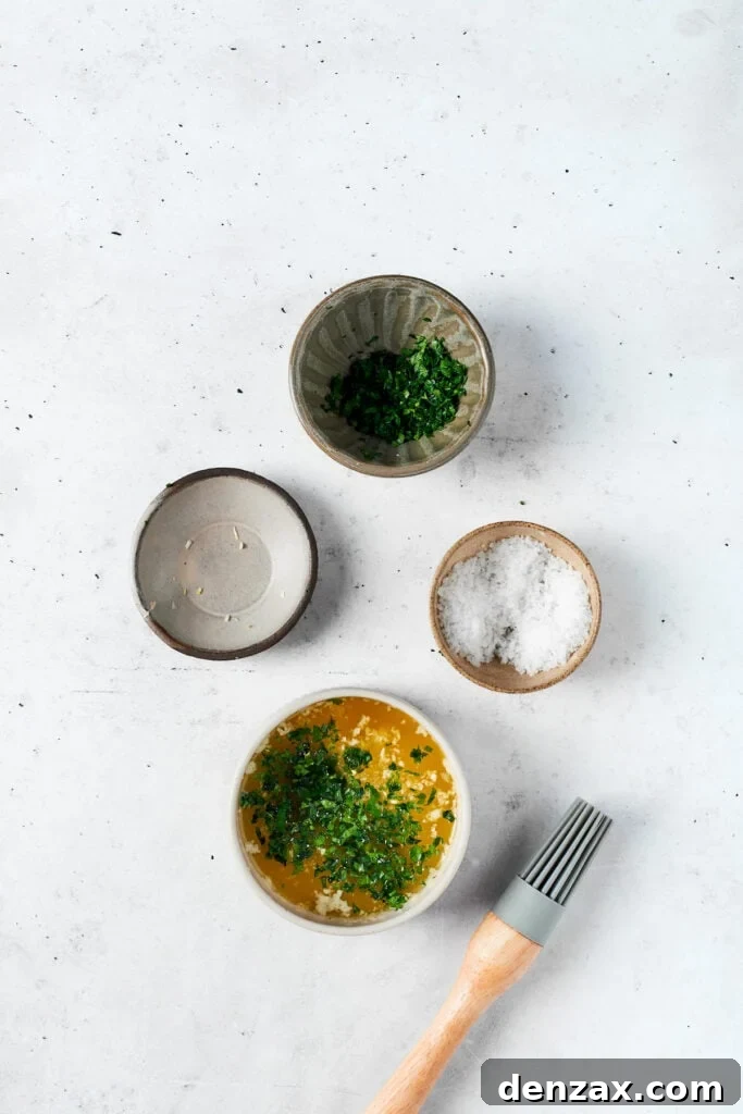 Chicken Bacon Ranch Sliders feature tender bites of shredded chicken, crisp bacon Ranch dressing, melted cheese, and sweet rolls. Bowls of melted butter and parsley salt minced garlic.
