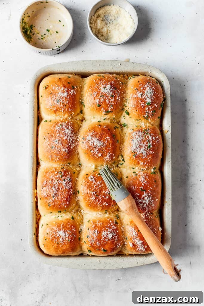 Chicken Bacon Ranch Sliders feature tender bites of shredded chicken, crisp bacon Ranch dressing, melted cheese, and sweet rolls. Tops of sliders brushed with melted butter.