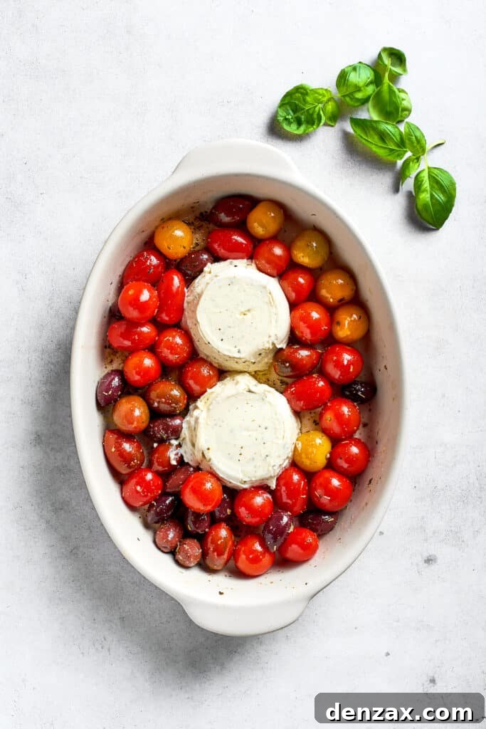 Two blocks of Boursin cheese are added to the tomatoes.