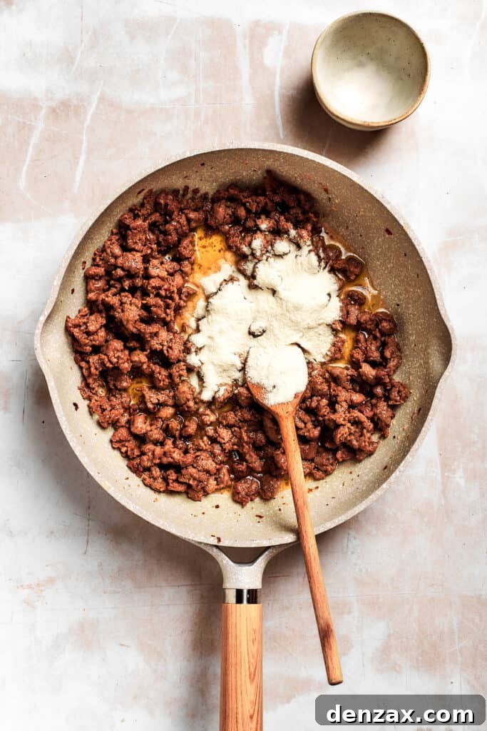 Flour is added into the pan.