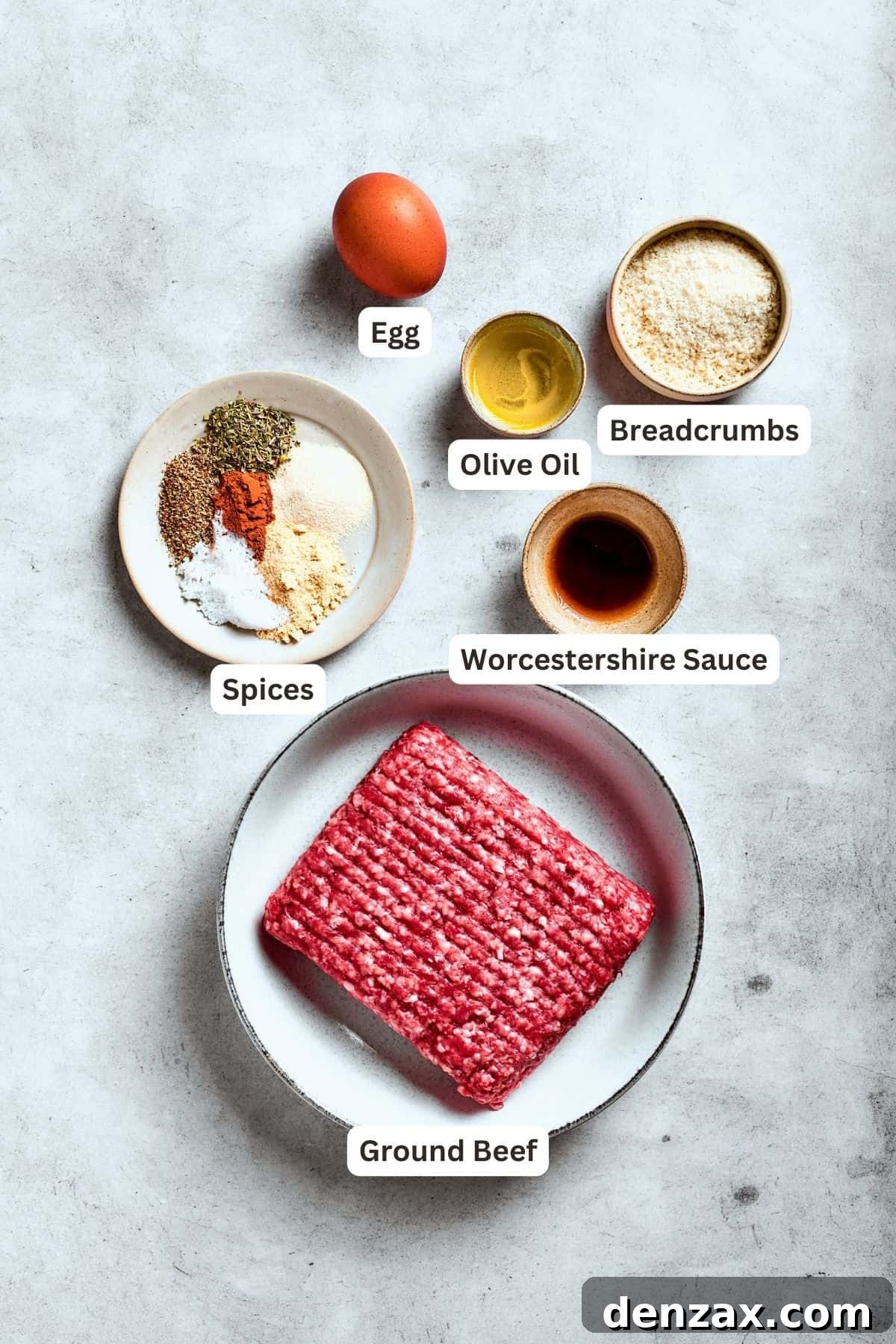 Ingredients for chopped steak are shown: ground beef, egg, seasonings, salt and pepper, olive oil, breadcrumbs.