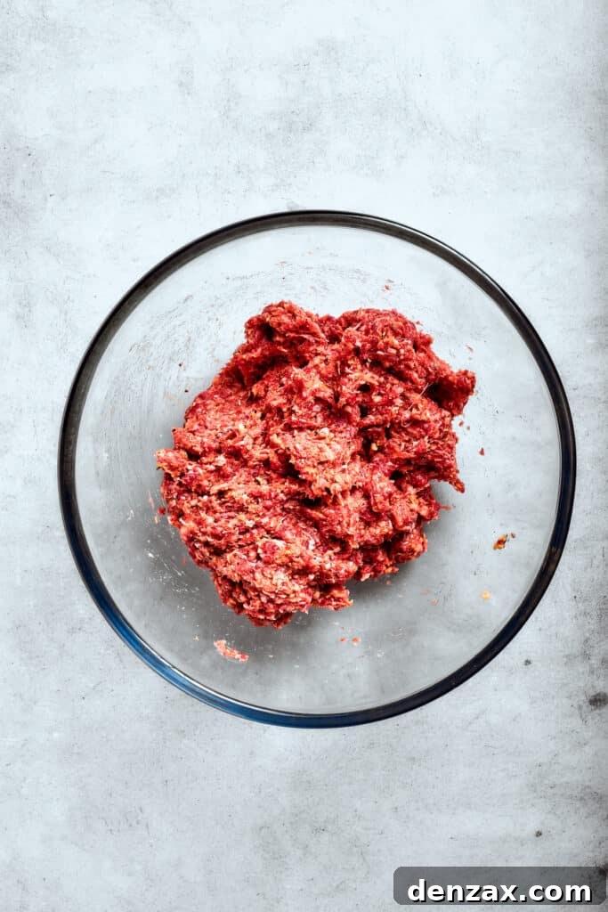 The egg and breadcrumbs are mixed into the meat.