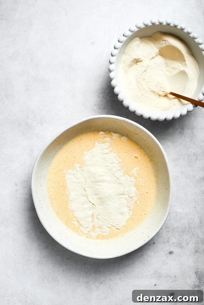 Add dry ingredients to wet mixture. The flour mixture is added to the wet mixture.