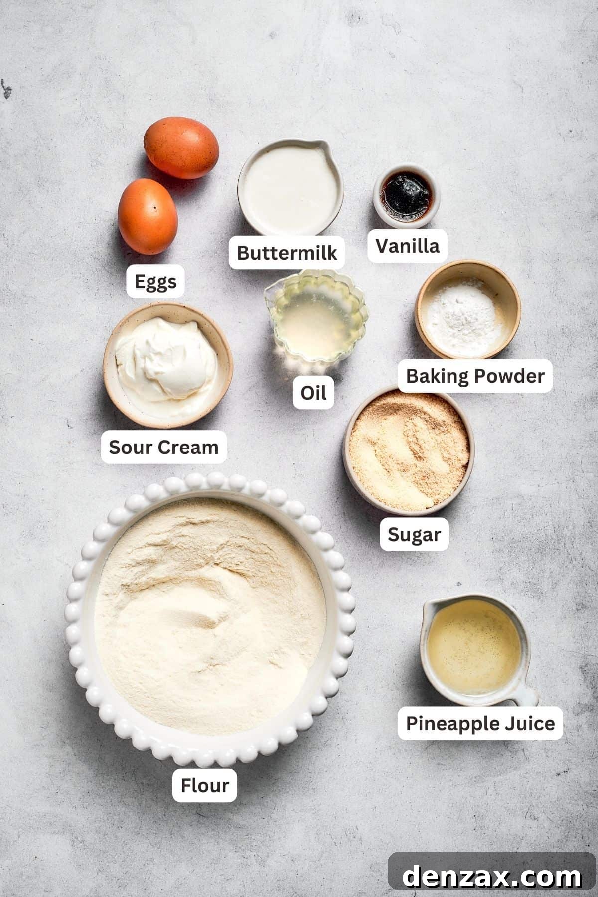 Cake ingredients for pineapple cake. Ingredients for pineapple cake are shown: flour, pineapple juice, baking powder, sugar, oil, vanilla, buttermilk, sour cream, eggs.