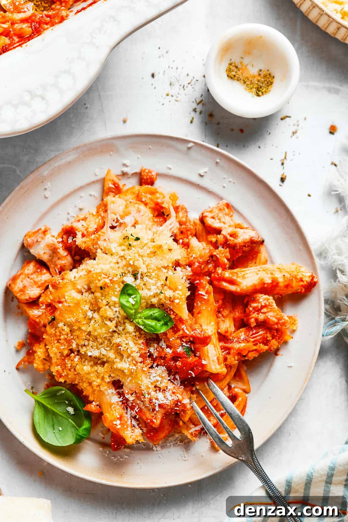 Baked pasta served on a dinner plate.