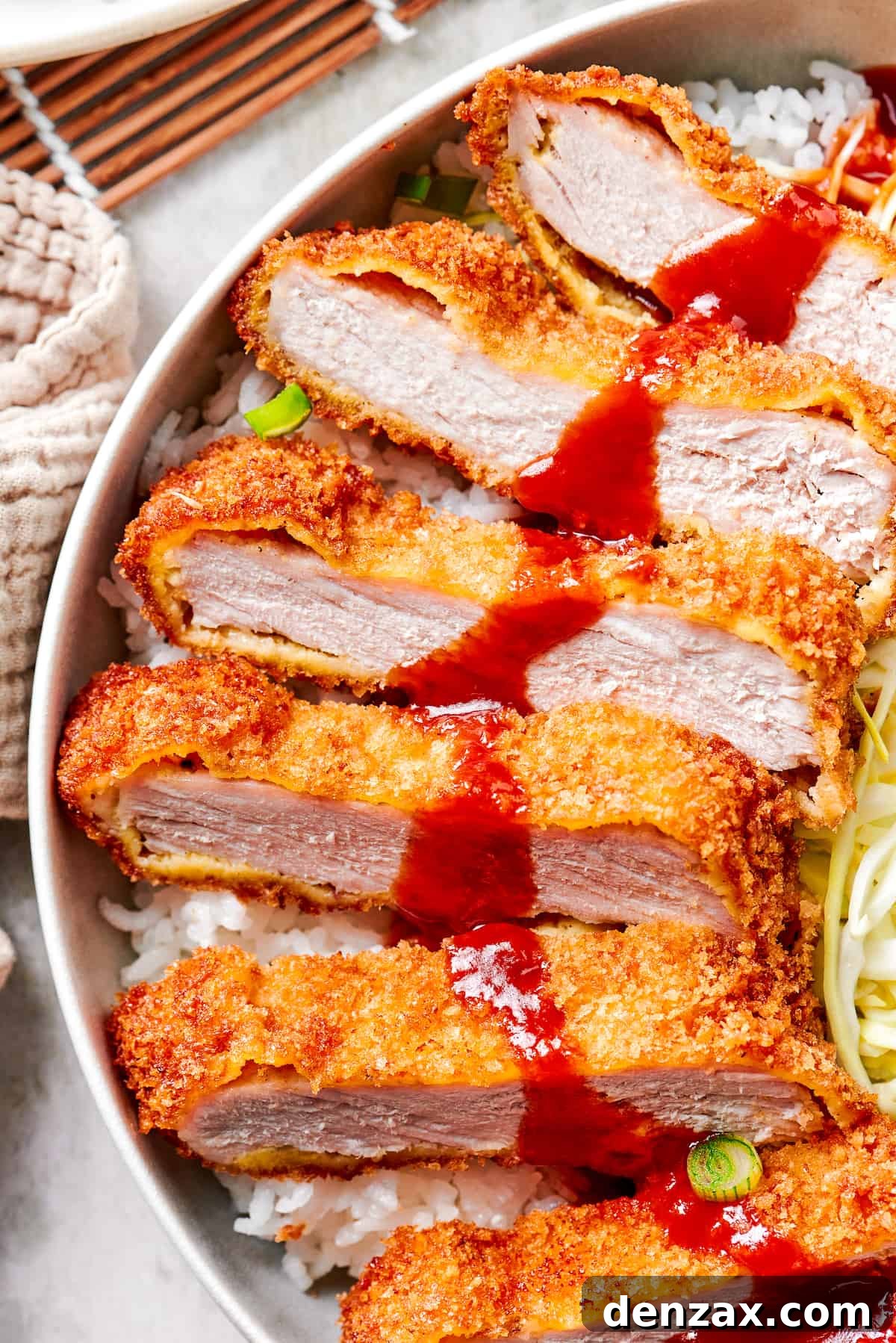 A close up of sliced pork katsu.