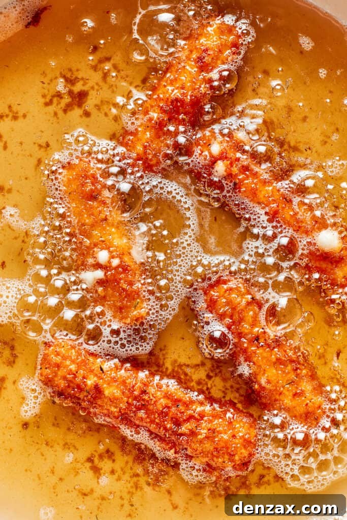 The mozzarella sticks are fried in oil.