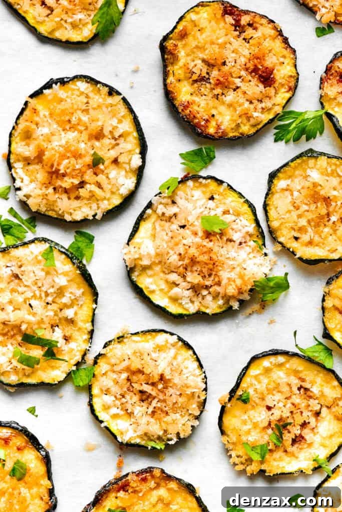 Slices of baked zucchini arranged neatly on a light surface.