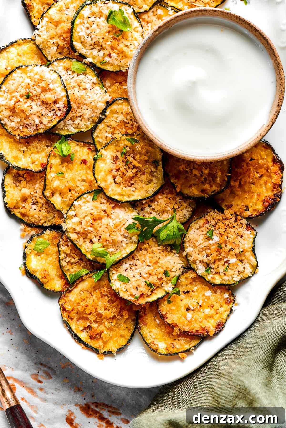 Zucchini chips served on a platter.