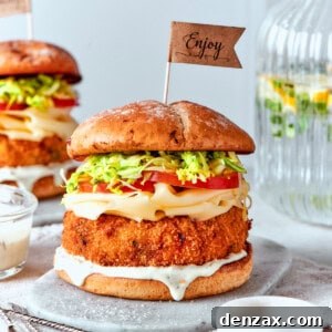 Sauce is seen dripping from a shrimp burger.
