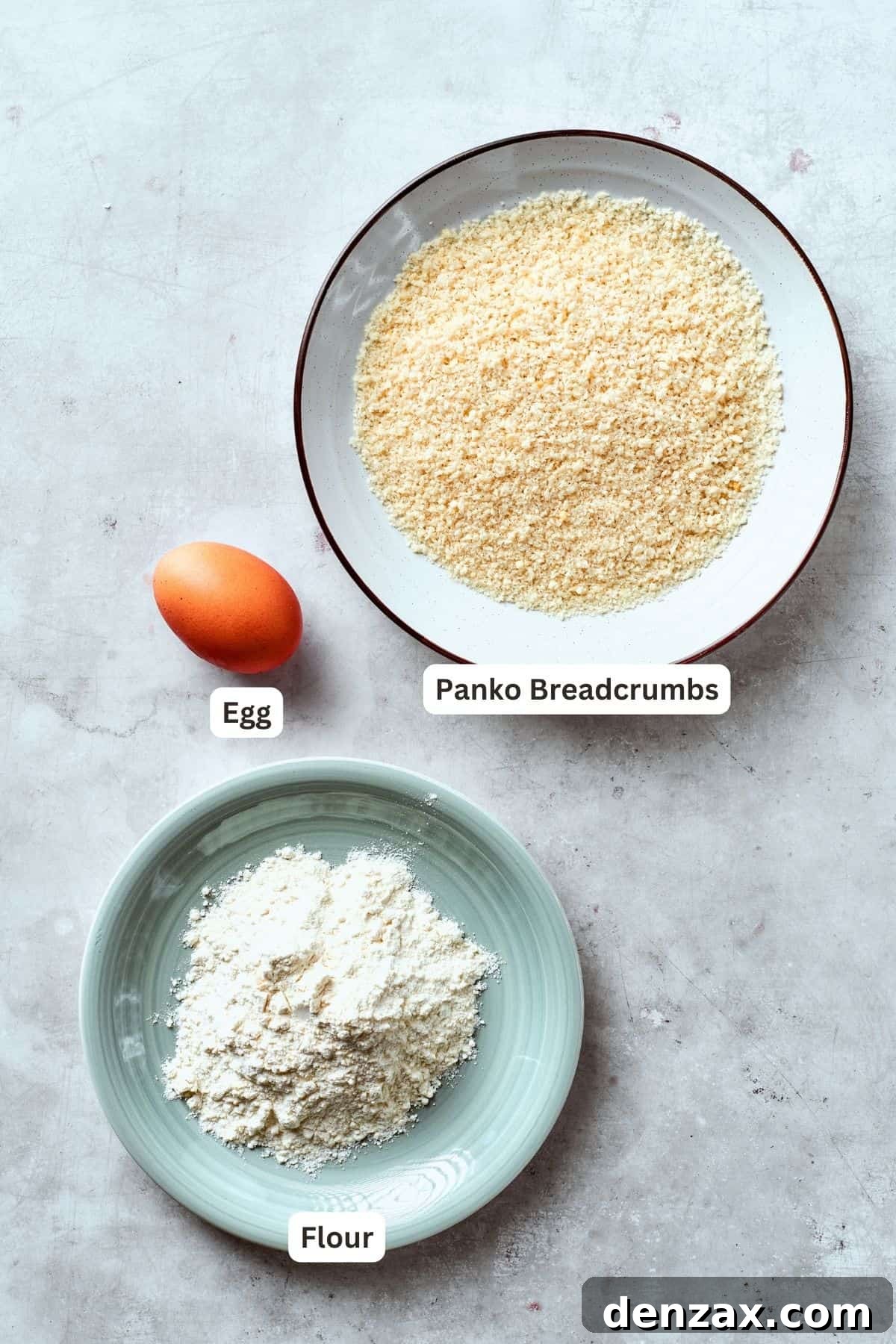 The breading to make shrimp burgers is shown portioned out an labelled: panko bread crumbs, flour, egg.