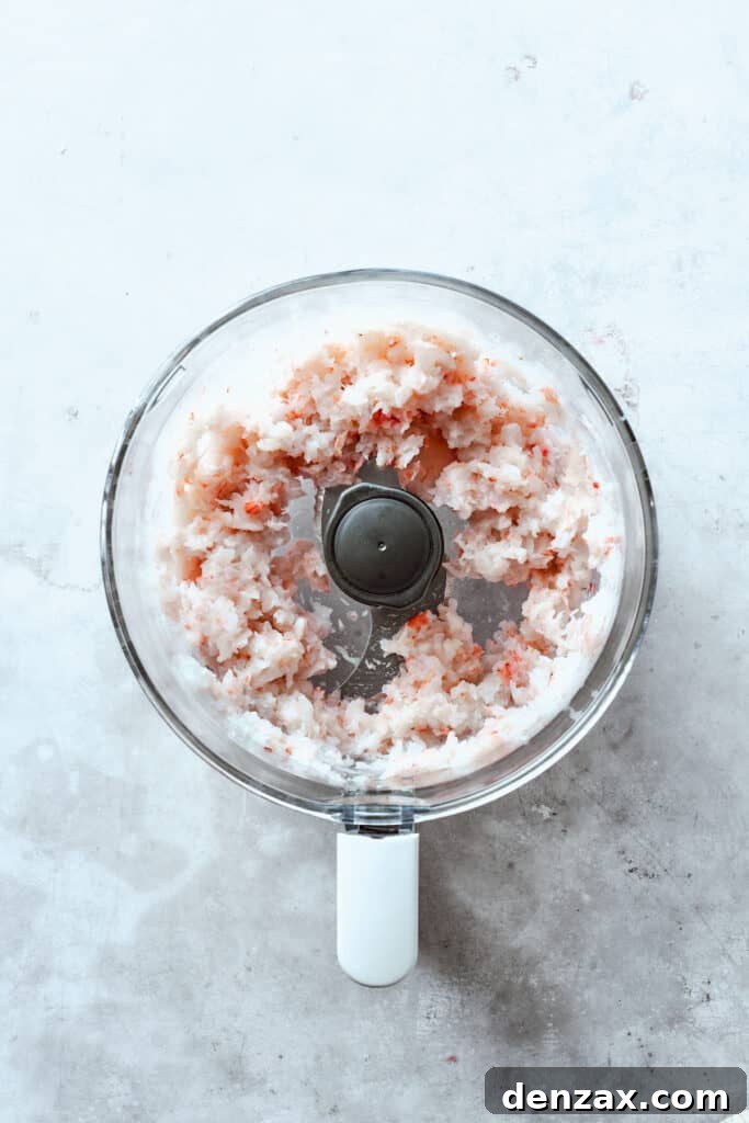 The shrimp is processed in a food processor.