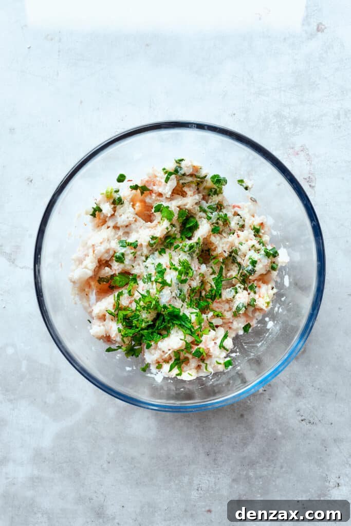 Parsley is added to the shrimp mixture.