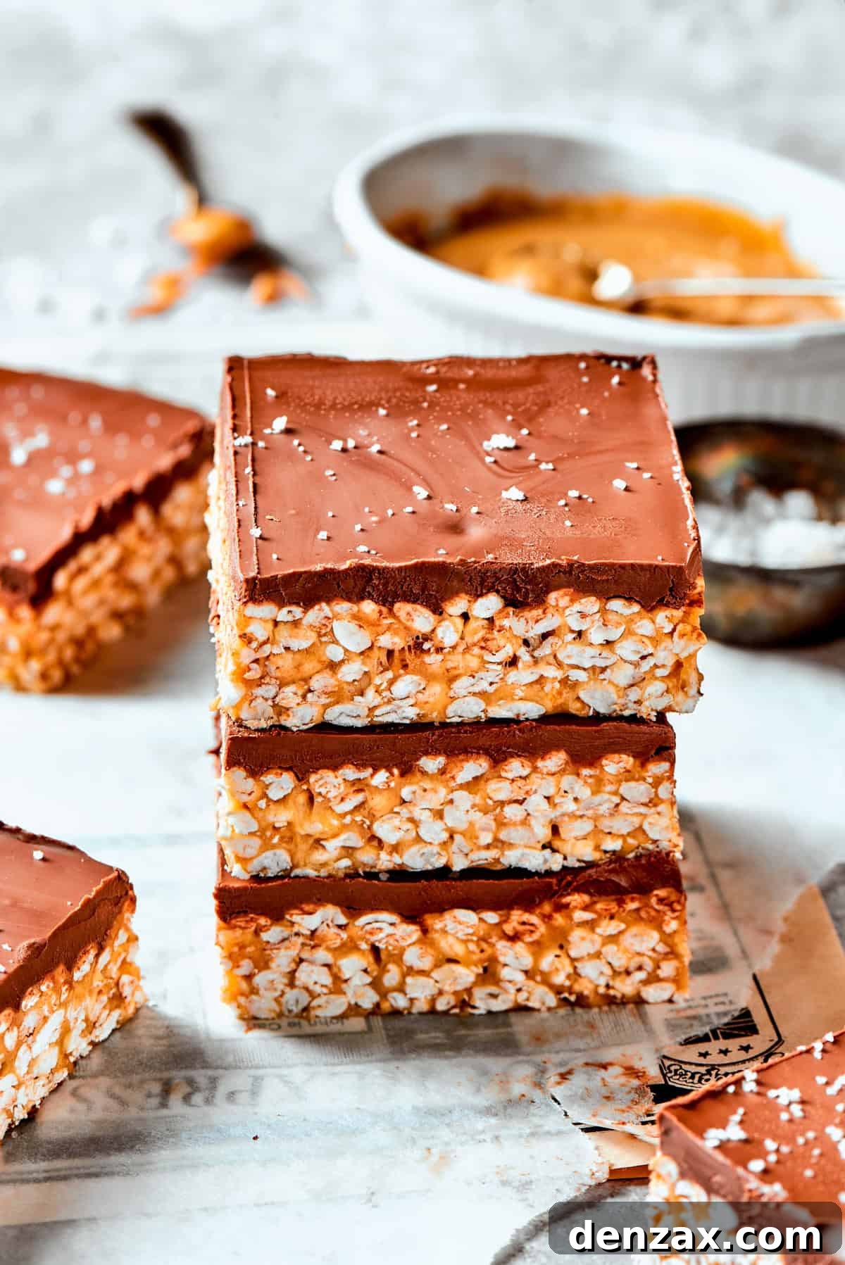Stacked bars Three crispy rice bars are layered one on top of the other.