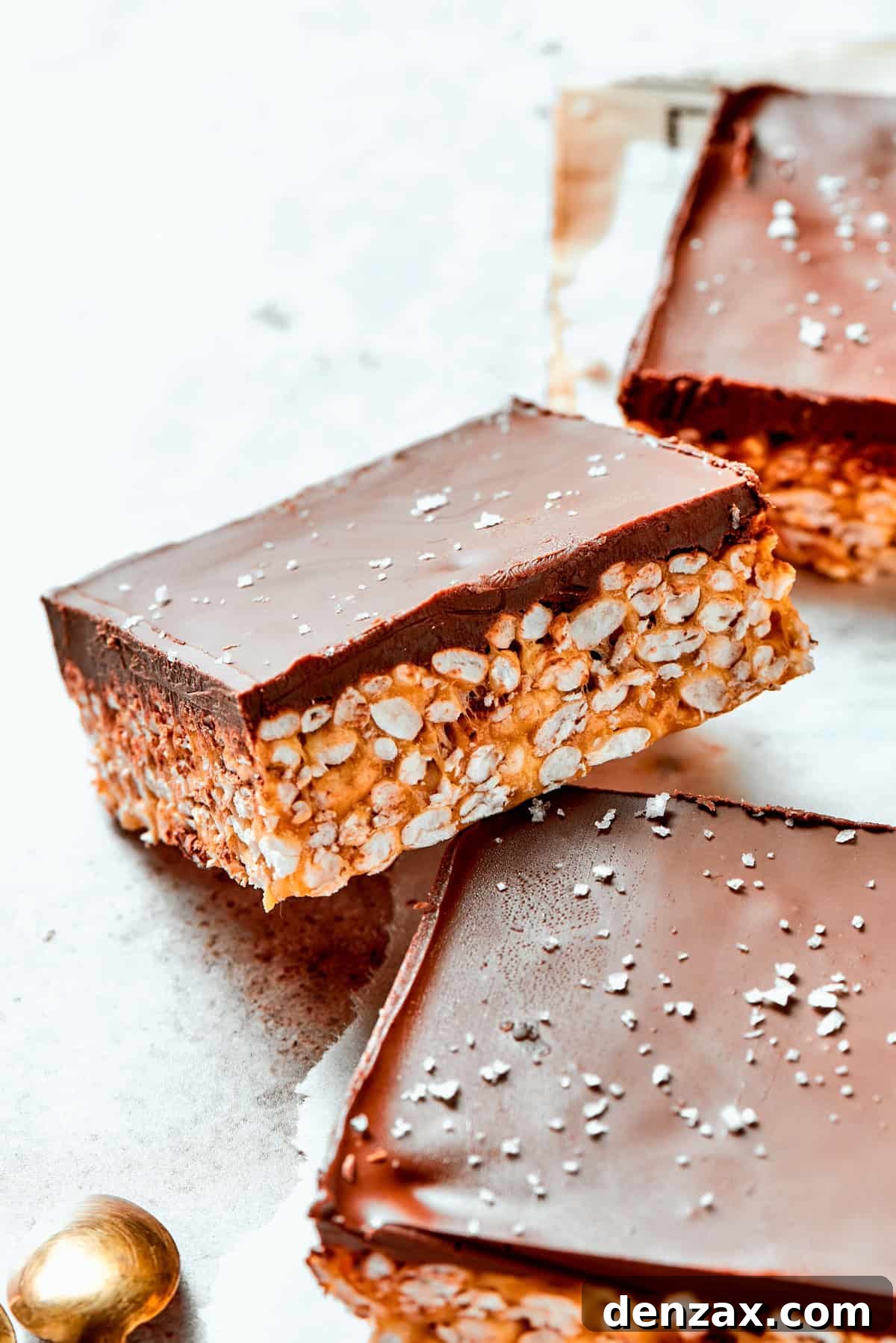 Peanut Butter Rice Crispy Treats A square bar of rice krispies topped with a layer of melted chocolate.