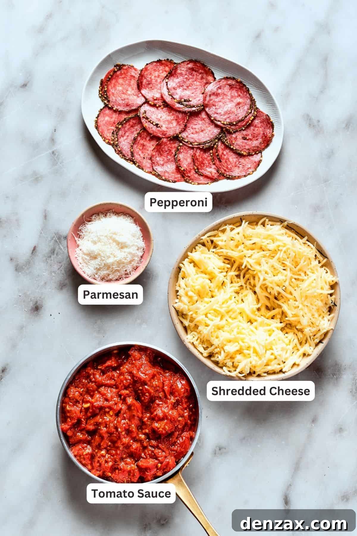 Deep dish pizza toppings: cheese, parmesan, tomato sauce, pepperoni.