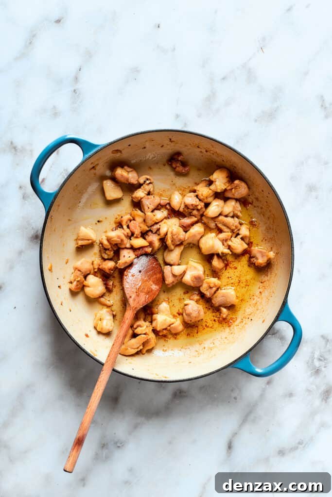 Chicken browning in the pot.