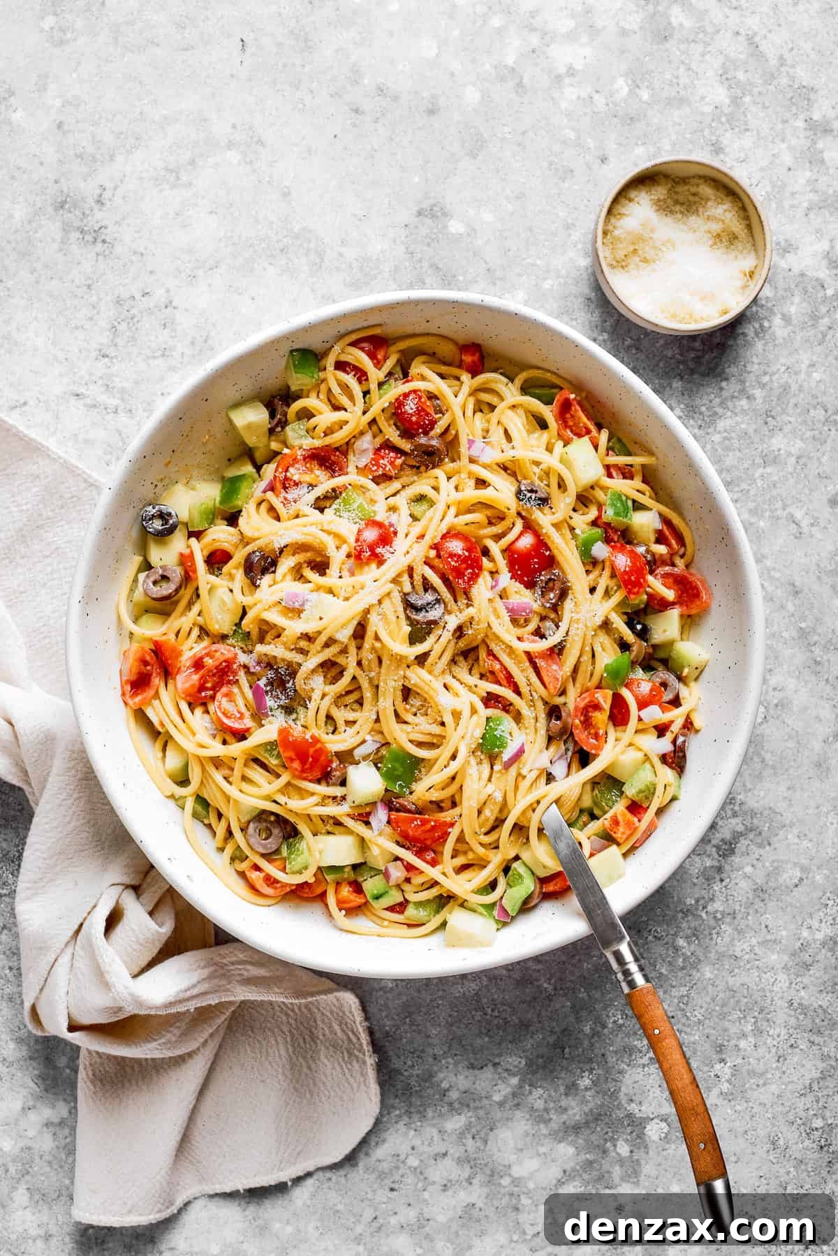The vegetables are mixed into the noodles.