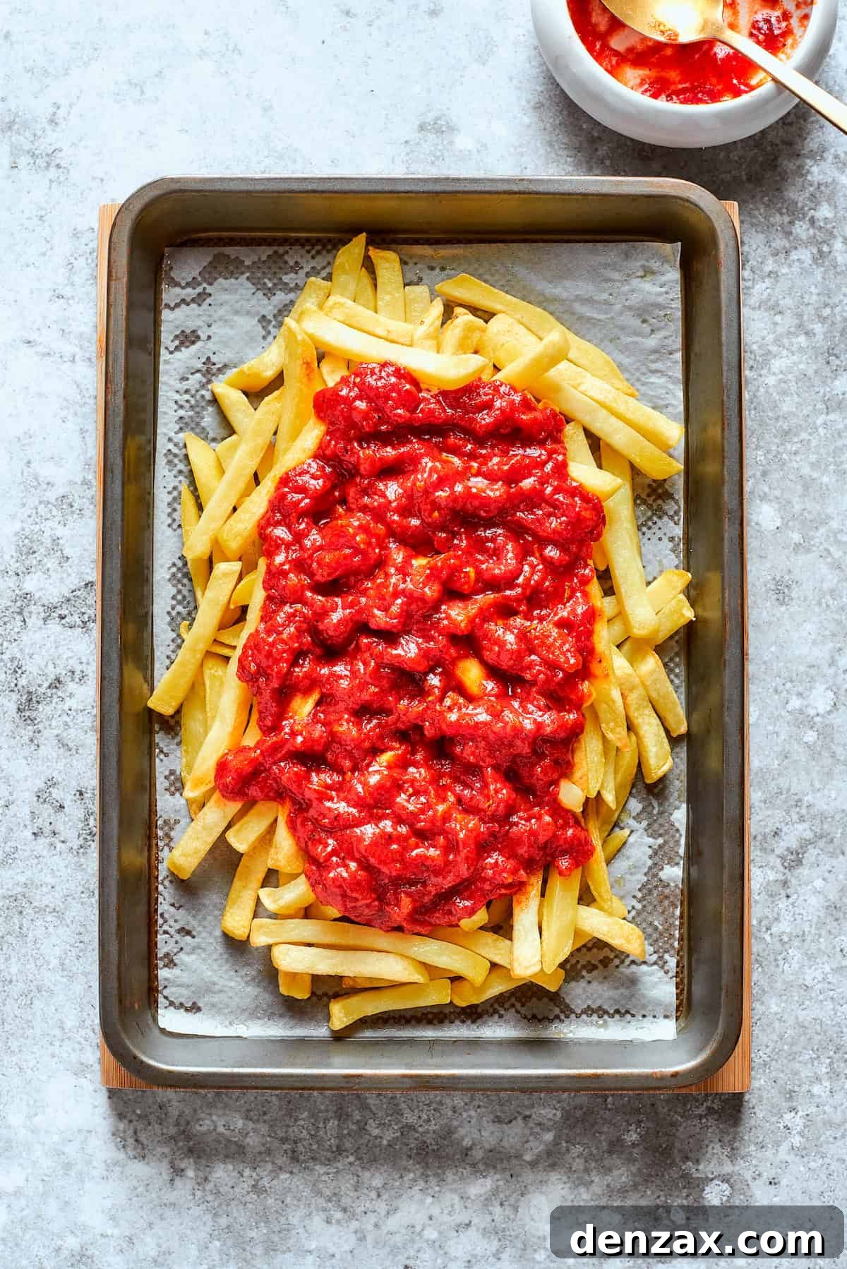 Sauce is added to the cooked fries,