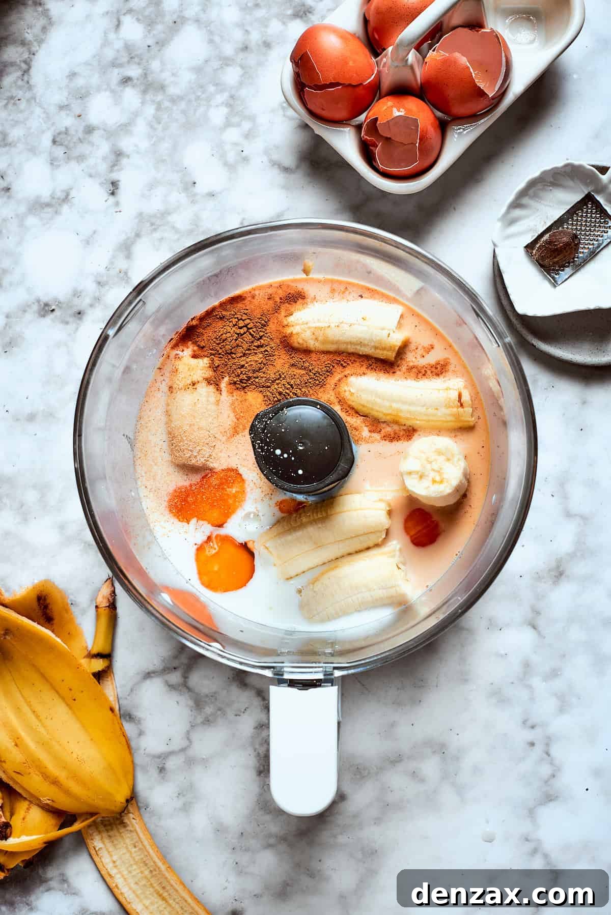 Bananas and batter ingredients in a food processor.