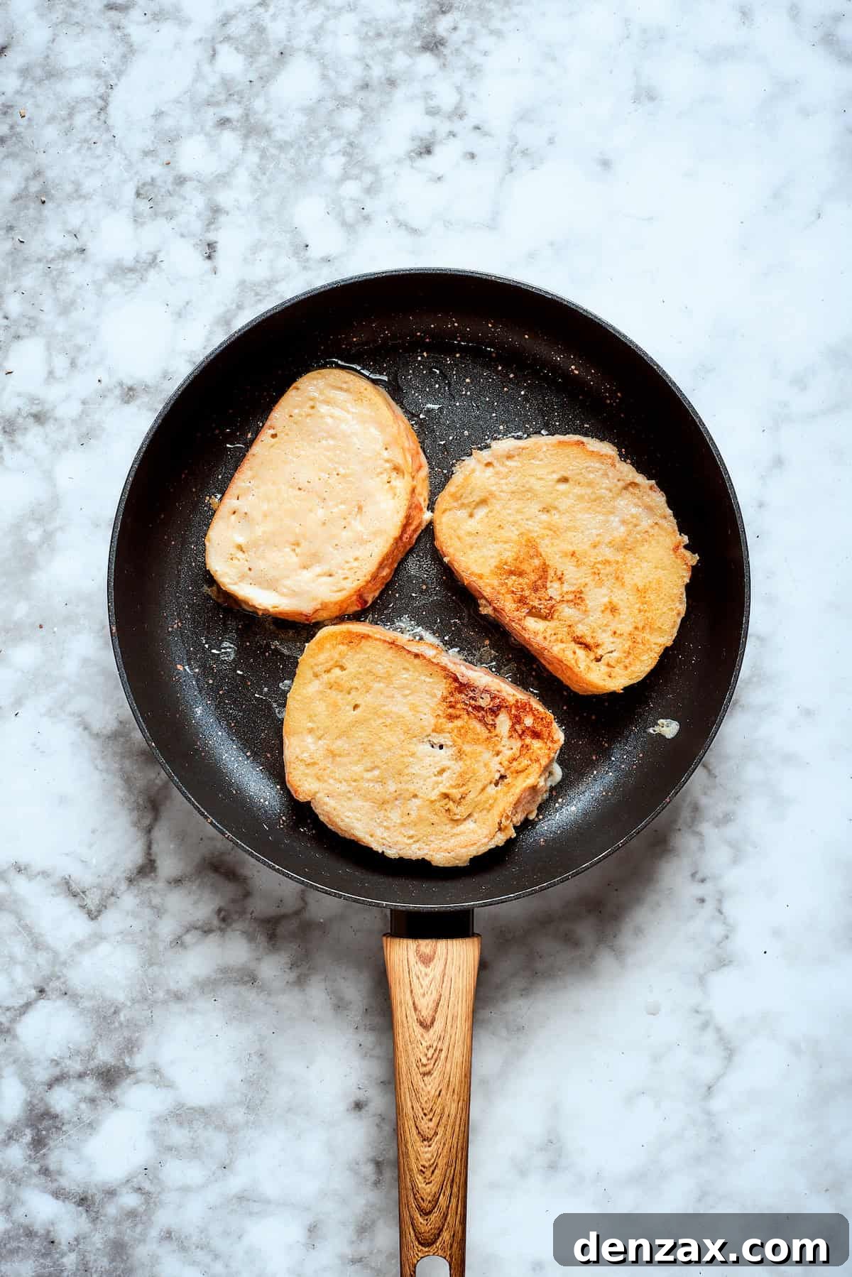 French toast frying in a skillet.