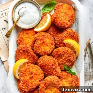 A serving tray with homemade chicken nuggets and a dish of ranch dressing and lemon slices.